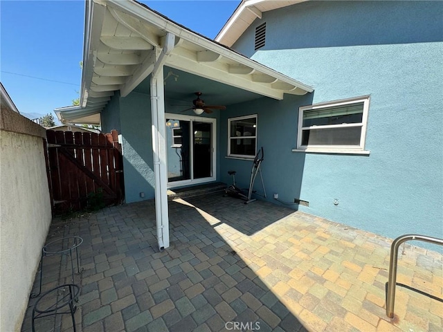 view of patio featuring ceiling fan