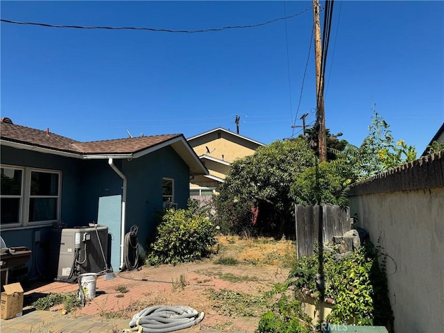 view of yard featuring central air condition unit