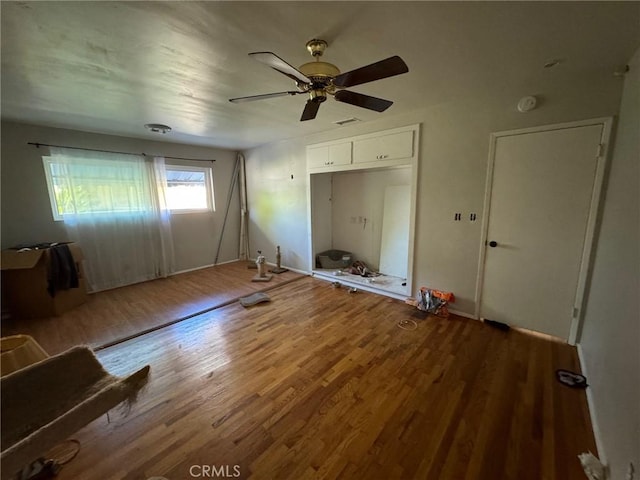 unfurnished bedroom featuring ceiling fan and hardwood / wood-style flooring