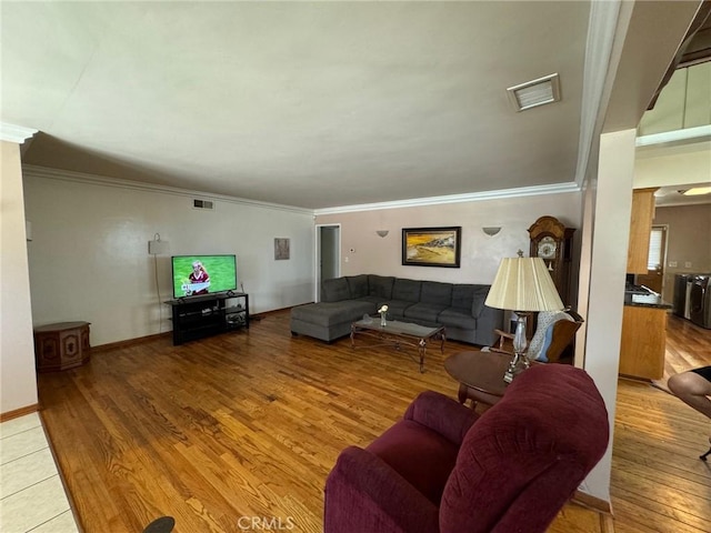 living room featuring ornamental molding and hardwood / wood-style flooring