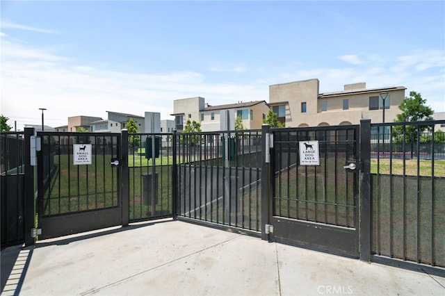 3570 E Peckham Paseo Unit 3, Ontario, CA 91761 - view of gate with fence and a residential view