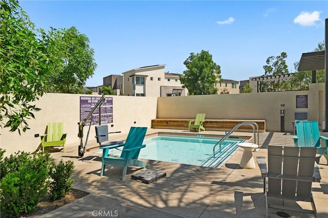 3570 E Peckham Paseo Unit 3, Ontario, CA 91761 - view of swimming pool featuring a swimming pool, fence, and a patio