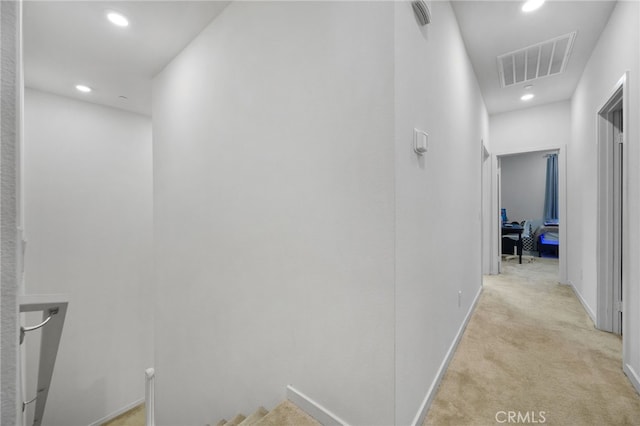 3570 E Peckham Paseo Unit 3, Ontario, CA 91761 - hall with light colored carpet, visible vents, baseboards, an upstairs landing, and recessed lighting