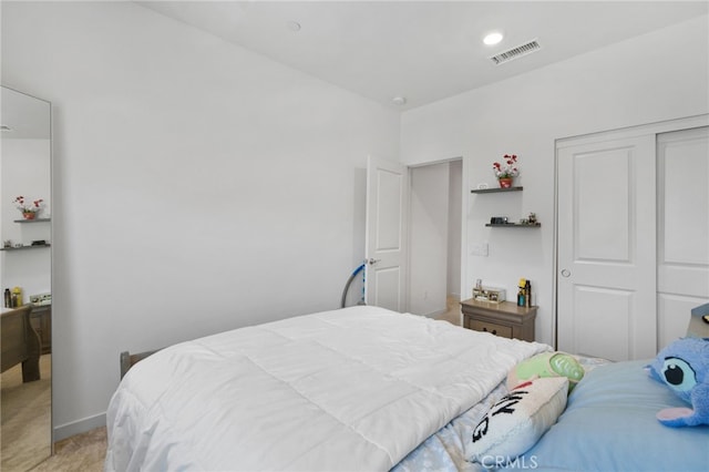 3570 E Peckham Paseo Unit 3, Ontario, CA 91761 - bedroom with visible vents, a closet, and light colored carpet