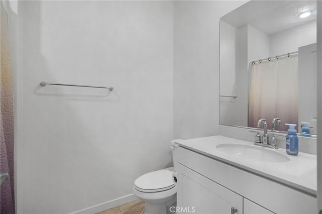 3570 E Peckham Paseo Unit 3, Ontario, CA 91761 - full bath with toilet, baseboards, a shower with shower curtain, and vanity