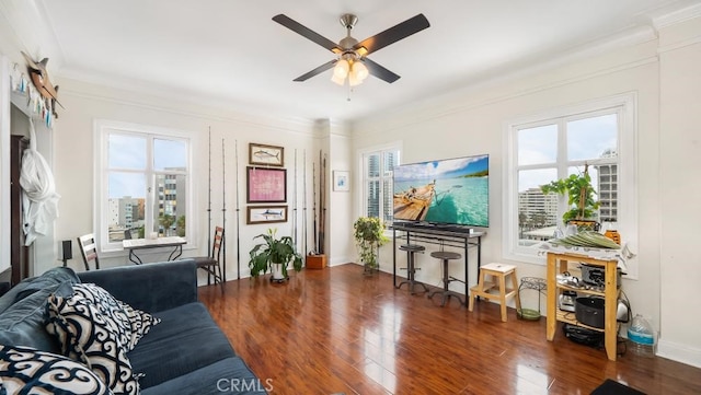 living room with ornamental molding, dark hardwood / wood-style floors, and a healthy amount of sunlight