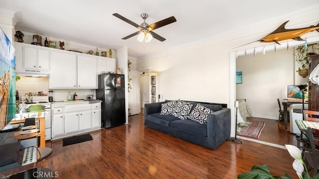 living room with dark hardwood / wood-style floors and ceiling fan