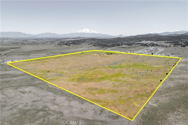 birds eye view of property featuring a mountain view