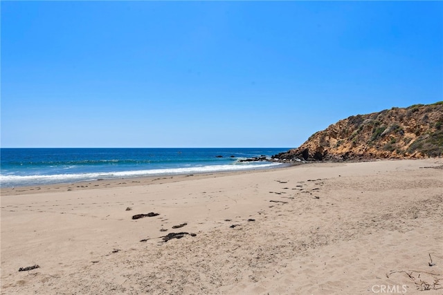 property view of water featuring a beach view