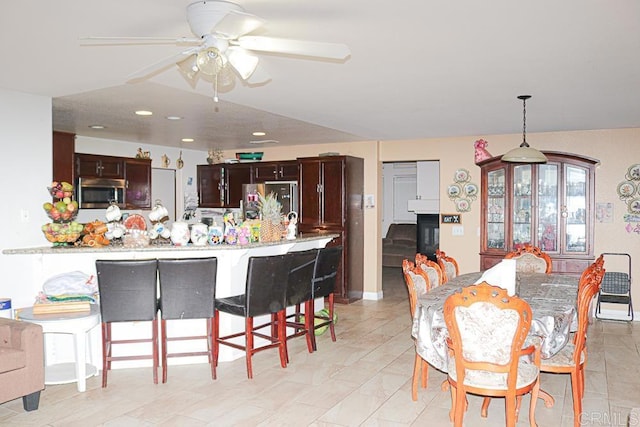 dining space with ceiling fan