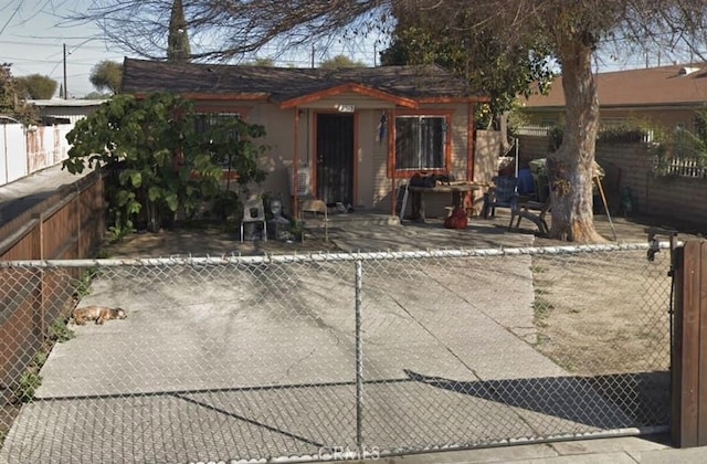 rear view of property featuring a patio