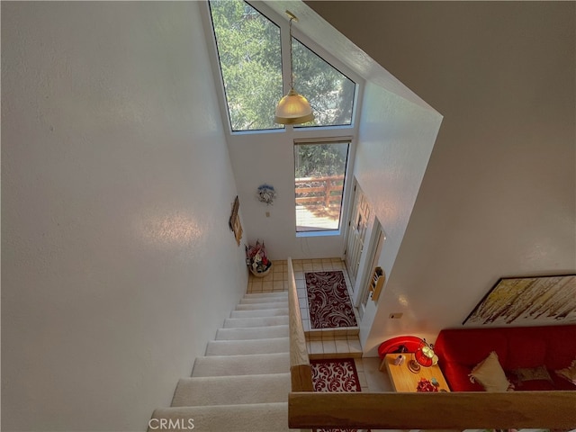 stairs with tile patterned flooring