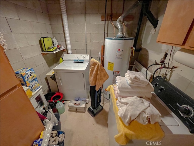 utility room featuring gas water heater and washer / dryer