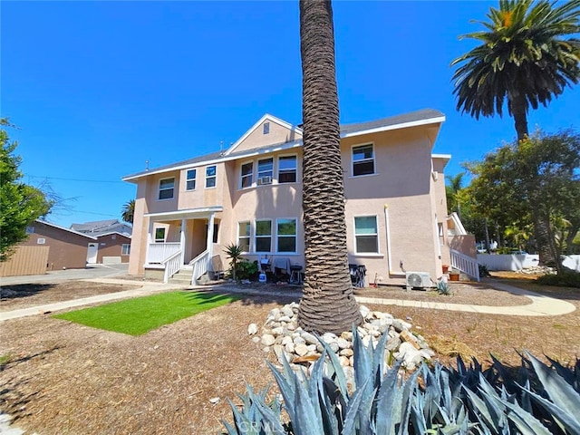 back of property with a garage