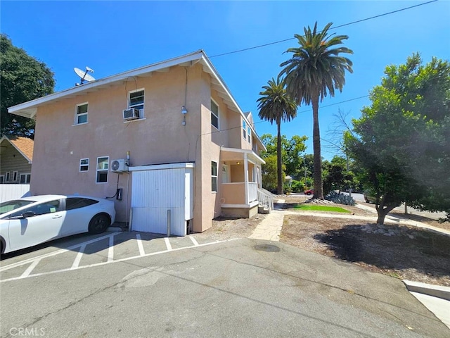 view of side of property featuring cooling unit