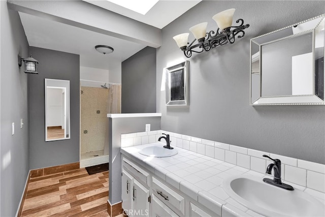 bathroom featuring vanity, curtained shower, and hardwood / wood-style flooring