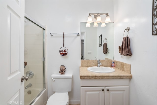 full bathroom with vanity, toilet, and enclosed tub / shower combo