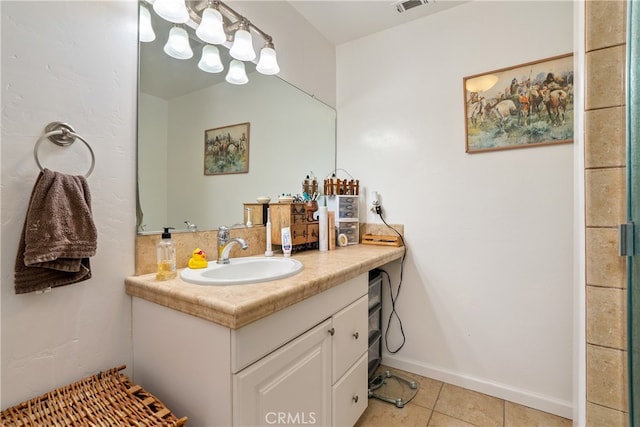 bathroom with vanity and tile patterned flooring