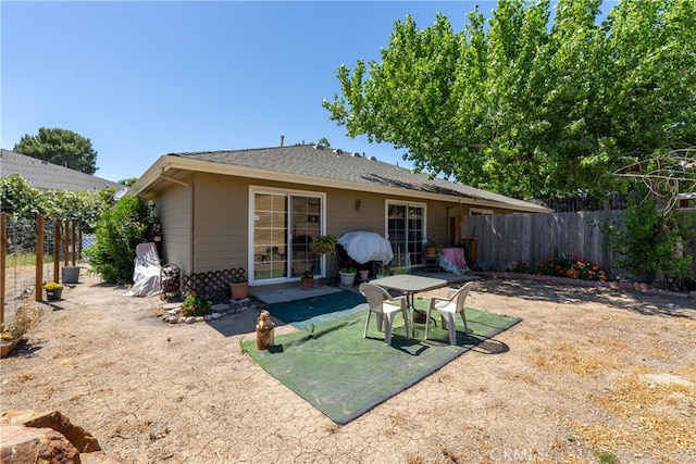 back of property with a patio area