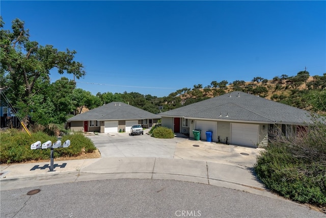 single story home featuring a garage