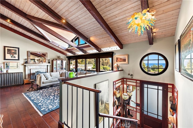 interior space featuring wooden ceiling, beam ceiling, dark hardwood / wood-style flooring, and high vaulted ceiling