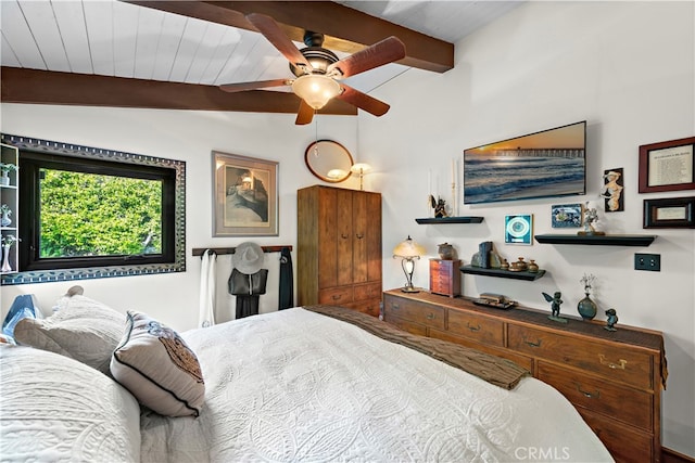 bedroom with lofted ceiling with beams and ceiling fan