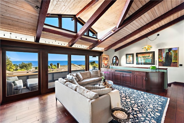 living room with a water view, plenty of natural light, and dark wood-type flooring