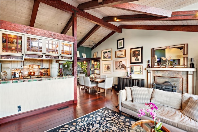 living room with high vaulted ceiling, beamed ceiling, wooden ceiling, dark hardwood / wood-style floors, and a premium fireplace