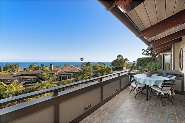 balcony featuring a water view