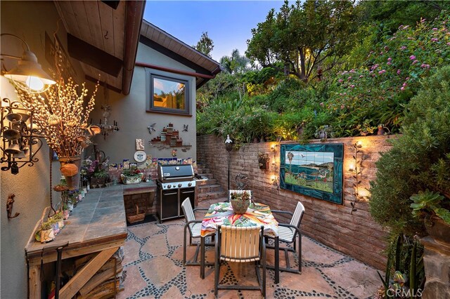 view of patio with a grill