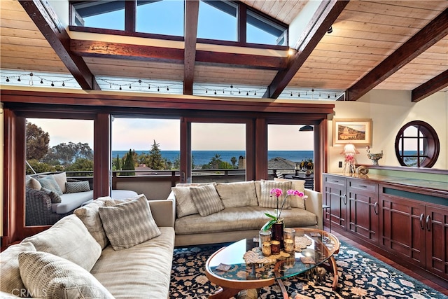 living room with vaulted ceiling with beams, wood ceiling, a water view, and a wealth of natural light