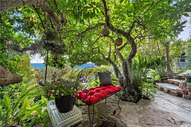 view of patio featuring a water view