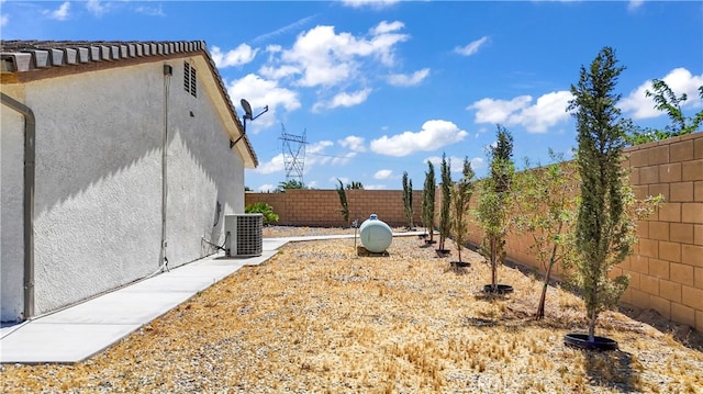 view of yard featuring central AC