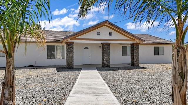 single story home featuring a patio