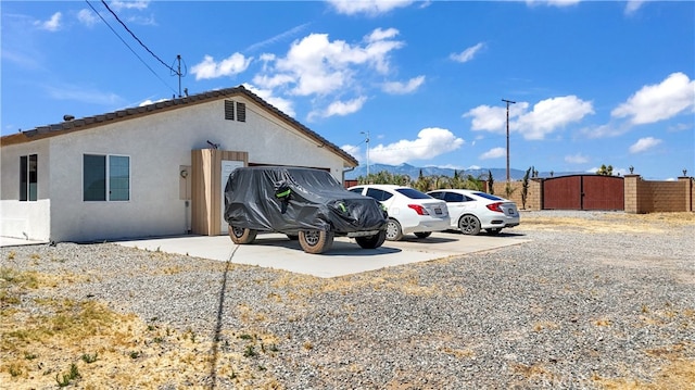 view of home's exterior with a mountain view