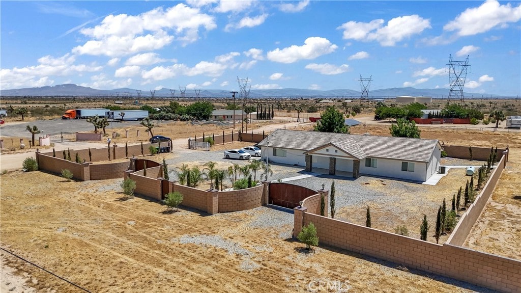 birds eye view of property with a mountain view