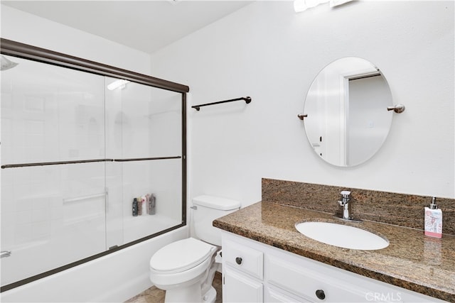 full bathroom with vanity, shower / bath combination with glass door, and toilet