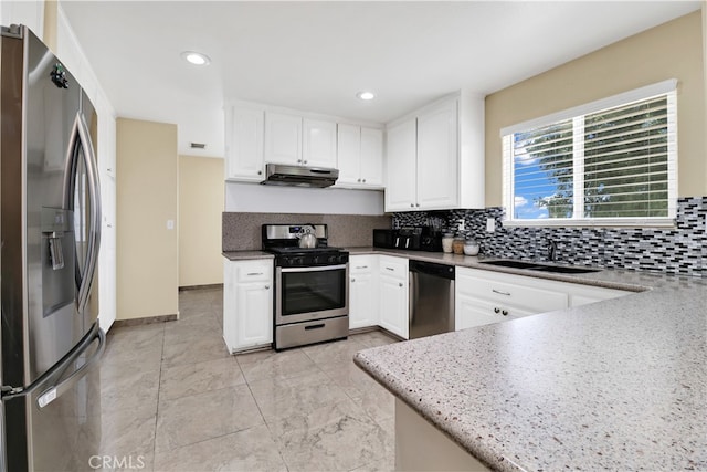 kitchen featuring white cabinetry, stainless steel appliances, and sink