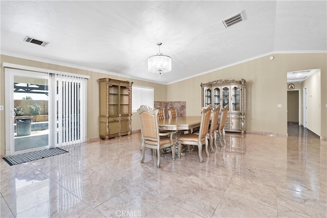 dining space featuring ornamental molding, a textured ceiling, a chandelier, and vaulted ceiling