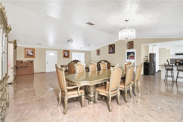 dining room with ornamental molding, vaulted ceiling, a notable chandelier, and a textured ceiling