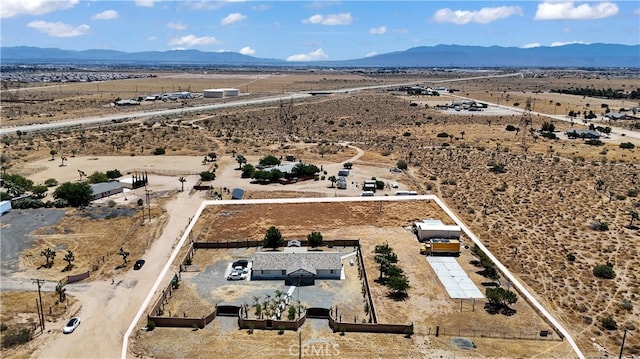 birds eye view of property featuring a mountain view