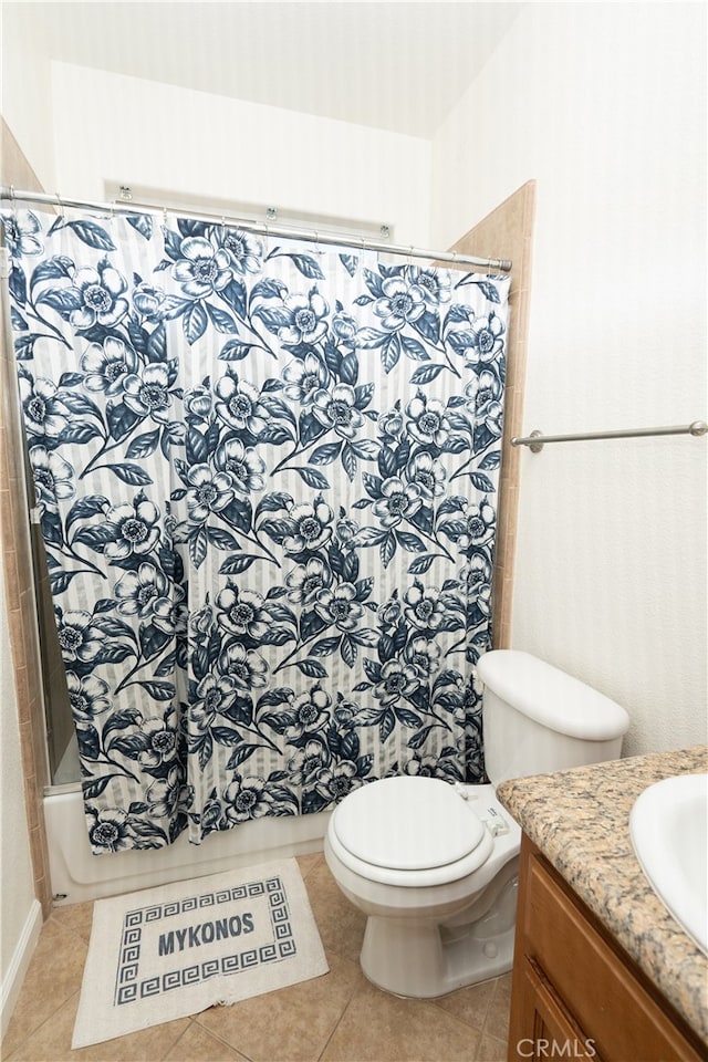 full bathroom with toilet, tile patterned flooring, vanity, and shower / tub combo with curtain