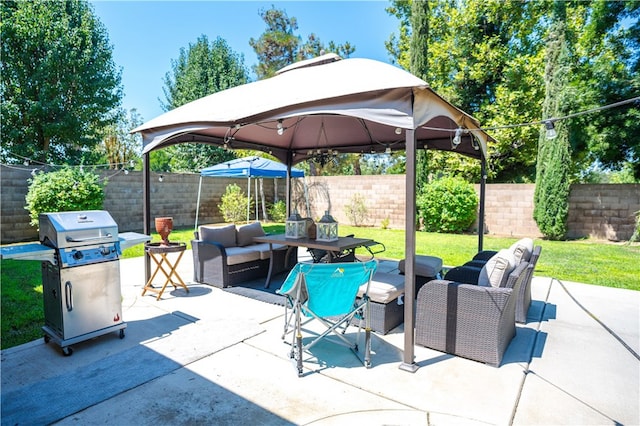 view of patio with outdoor lounge area and grilling area