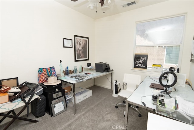 carpeted office with ceiling fan