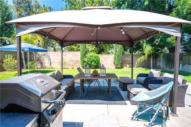 view of patio featuring a gazebo, a grill, and outdoor lounge area