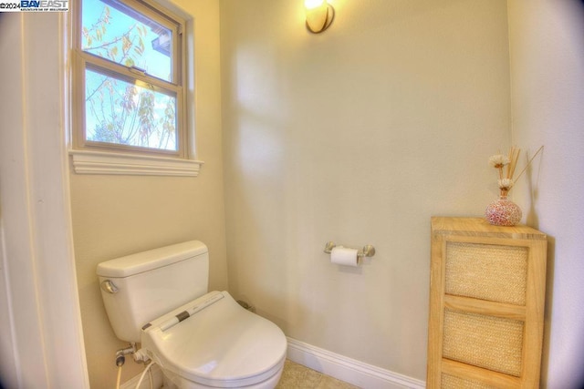 bathroom with tile patterned floors and toilet