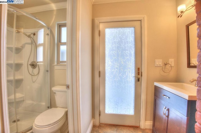 bathroom with plenty of natural light, toilet, and a shower with door