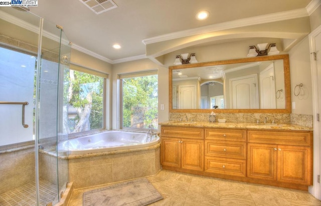 bathroom with tile patterned floors, crown molding, vanity, and separate shower and tub