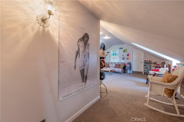 bedroom featuring lofted ceiling and carpet floors