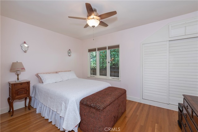 bedroom with ceiling fan and wood-type flooring